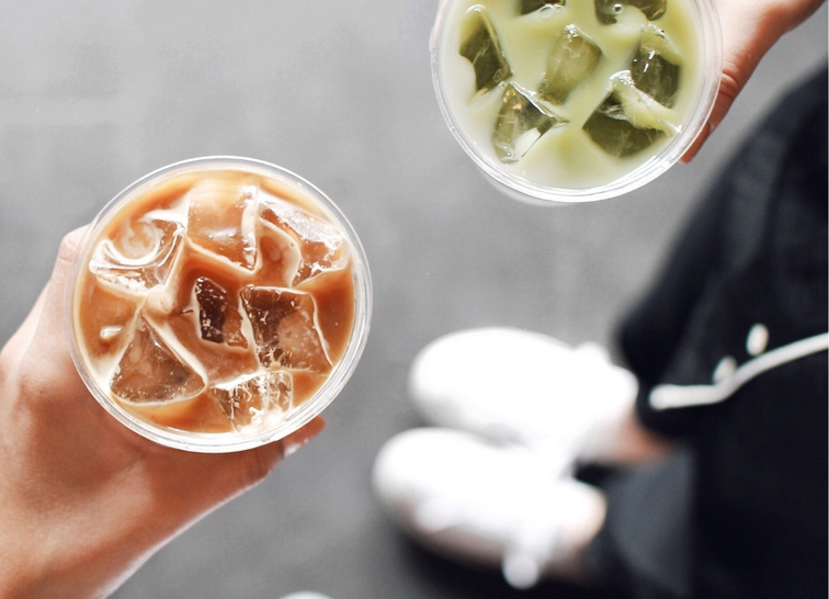 people showing starbucks drinks aerial view
