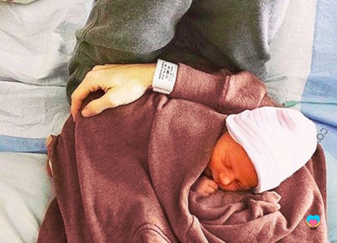 bun maternity nursing sweat shirt with newborn baby skin to skin and breastfeeding with mother