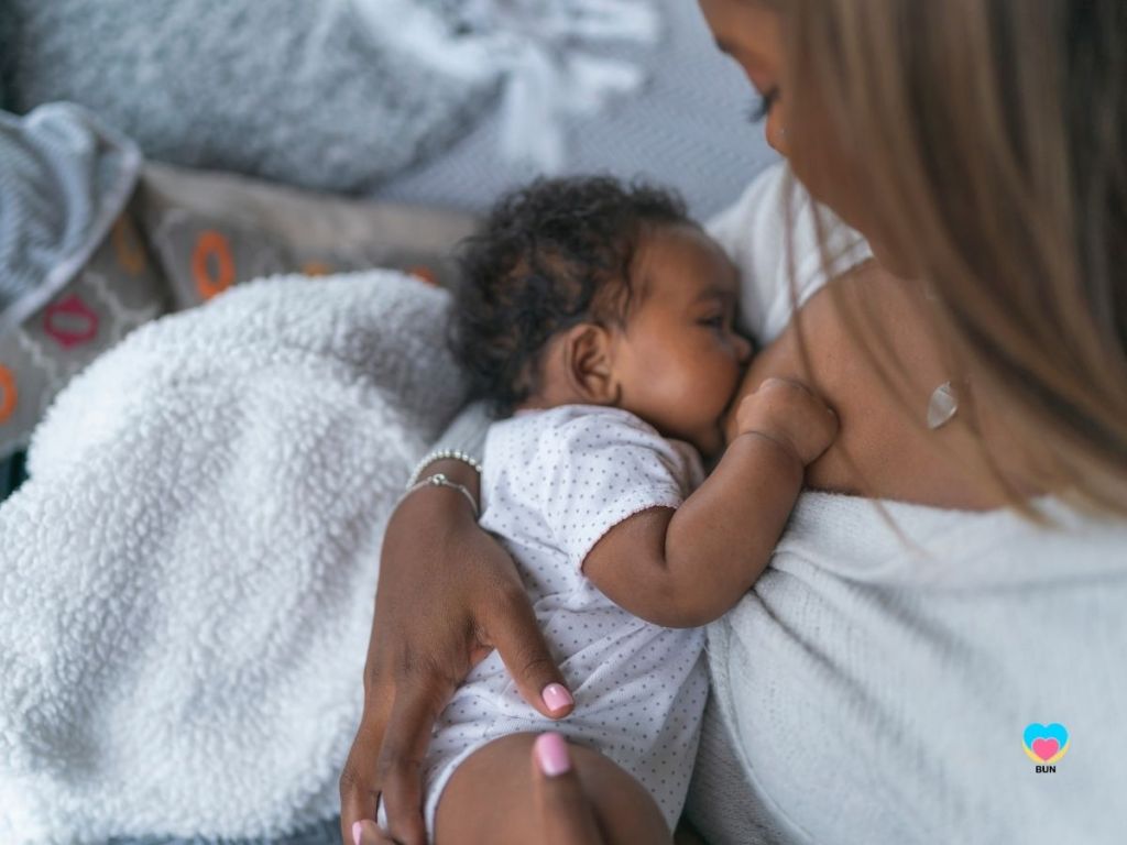 mother breastfeeding newborn